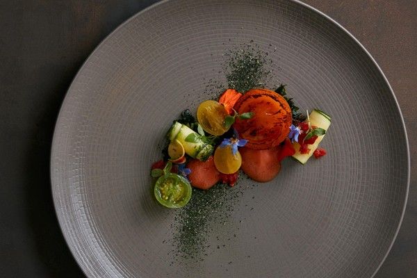 Marinated salmon with zucchini, cold tomato and grapefruit consommé